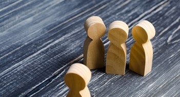 Dealing With Disruptive Residents Three people meet one. Three people are aggressively attuned to one. People conduct an interview and a meeting. The concept of attack, threats, encounters, education. Businessmen stand in a group of three.
