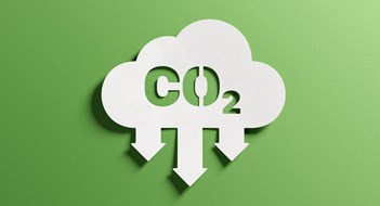 Local Laws & Energy Conservation Reduce CO2 emissions to limit climate change and global warming. Low greenhouse gas levels, decarbonize, net zero carbon dioxide footprint. Abstract minimalist design, cutout paper, green background.